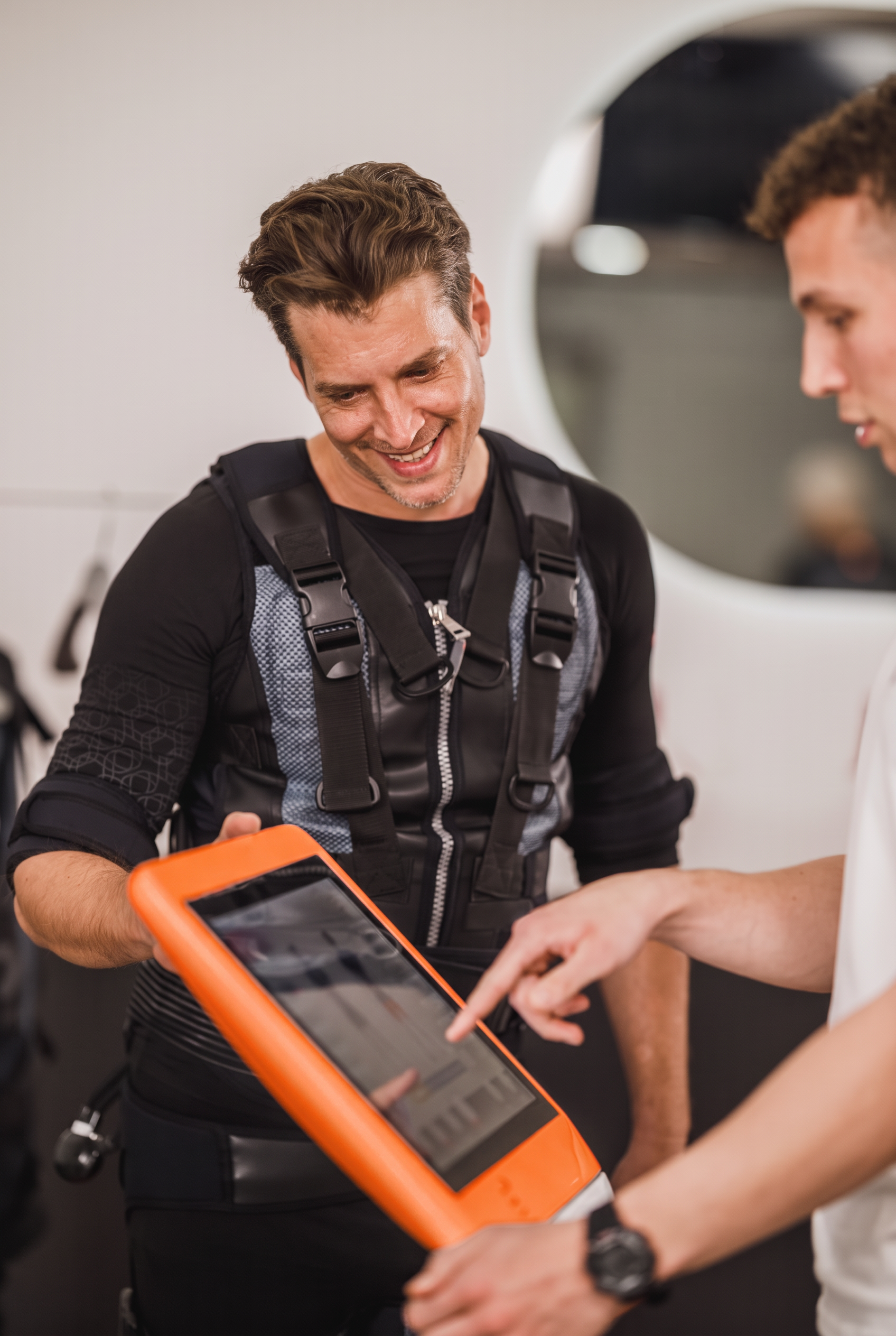 Therapist reviewing a tablet with a client during a session